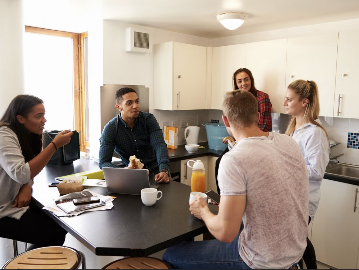 Students celebrating moving into their new home